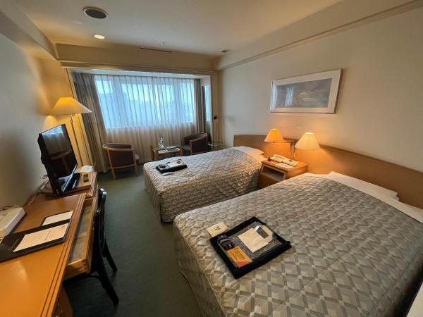 Jasmac Plaza Hotel : photo 1 de la chambre chambre lits jumeaux - bâtiment principal - fumeurs