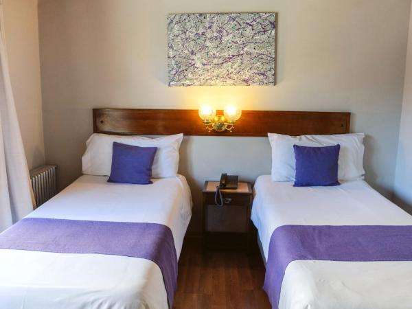 Hotel Concorde : photo 2 de la chambre chambre lits jumeaux - vue sur ville