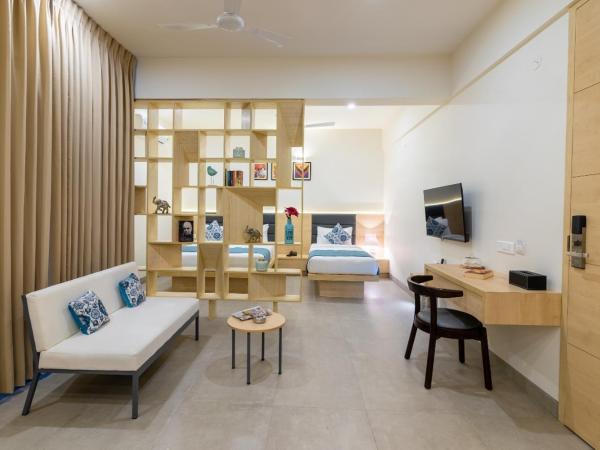 Iris Suites : photo 2 de la chambre chambre triple deluxe