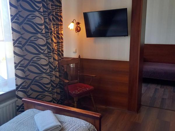 Dworek staropolski : photo 2 de la chambre chambre triple