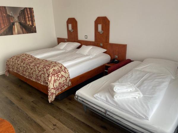 Apartment-Hotel Hamburg Mitte : photo 4 de la chambre chambre double avec canapé-lit