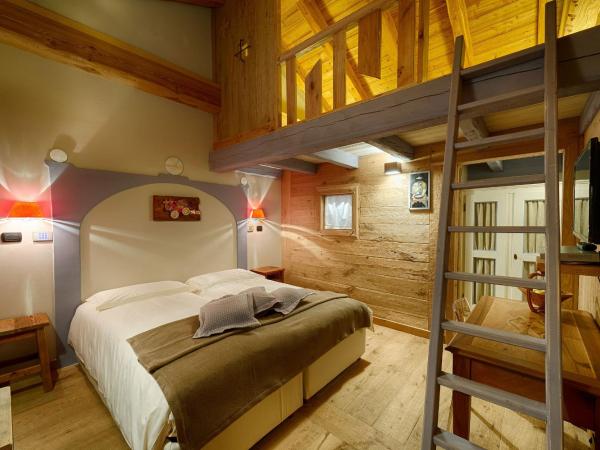 Les Plaisirs d'Antan : photo 4 de la chambre chambre double - duplex avec accès au spa