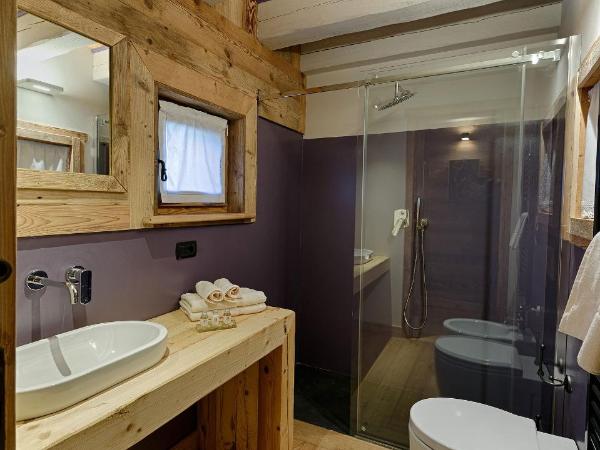 Les Plaisirs d'Antan : photo 9 de la chambre chambre double - duplex avec accès au spa