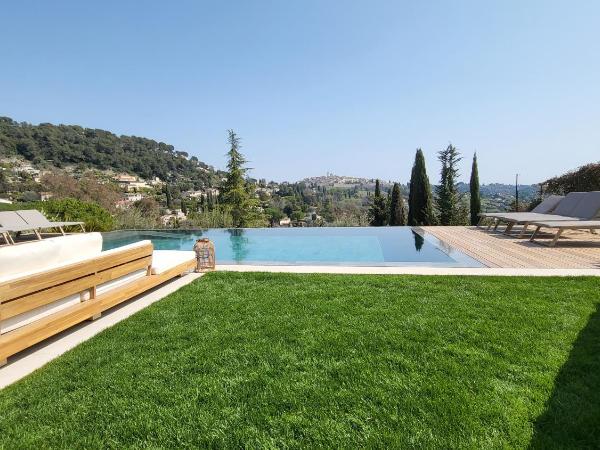 Ideal BnB : photo 9 de la chambre appartement avec piscine - vue sur jardin