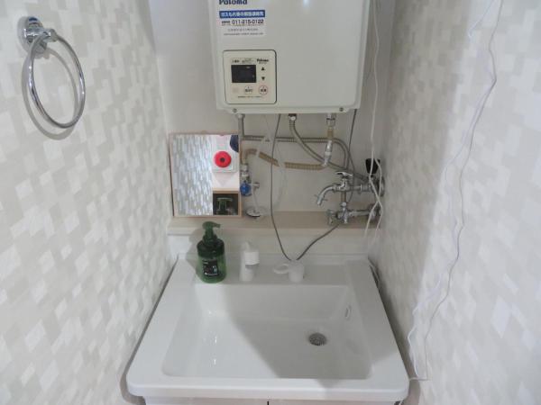 Sapporo Guest House Nariya : photo 7 de la chambre petite chambre lits jumeaux