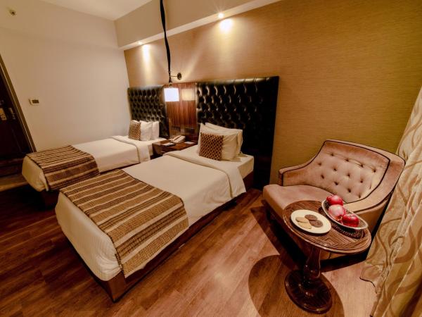 Sarovar Portico Jaipur : photo 2 de la chambre chambre double ou lits jumeaux supérieure