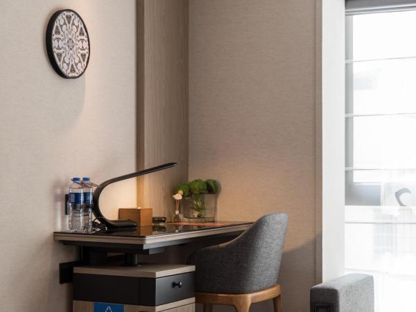 Paco Hotel Canton Tower Pazhou--FreeShuttle Bus for CantonFair : photo 2 de la chambre chambre lits jumeaux avec salle de bains