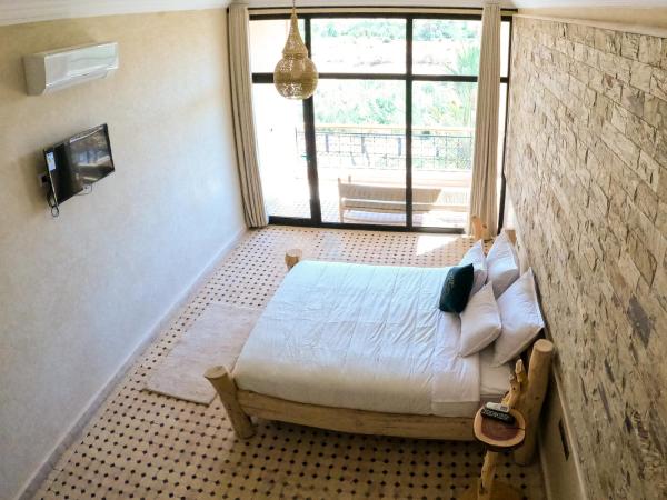 kasbah yu palace : photo 1 de la chambre chambre lits jumeaux - vue sur piscine