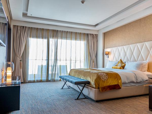 Royal Tulip City Center : photo 1 de la chambre suite lit king-size