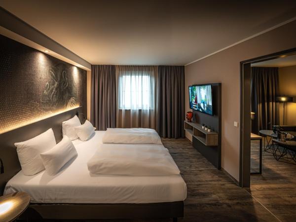 LOGINN Hotel Stuttgart Zuffenhausen : photo 6 de la chambre appartement deluxe