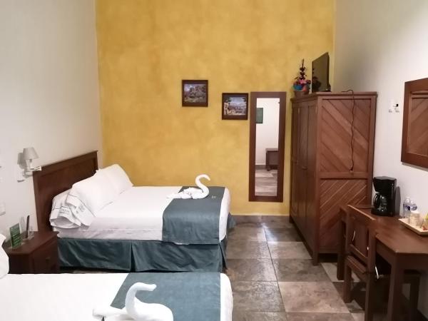 Casa Esmeralda Hotel : photo 1 de la chambre chambre double avec 2 lits doubles