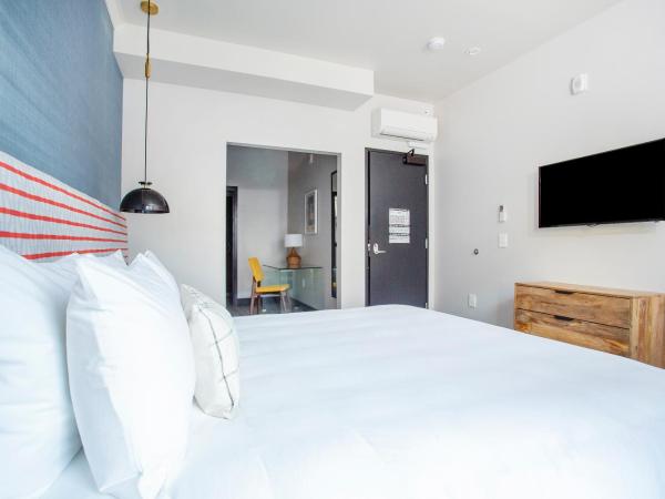 Hotel EPIK : photo 1 de la chambre suite deluxe avec lit king-size