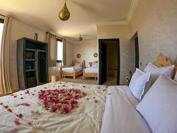 kasbah yu palace : photo 1 de la chambre chambre familiale - vue sur jardin