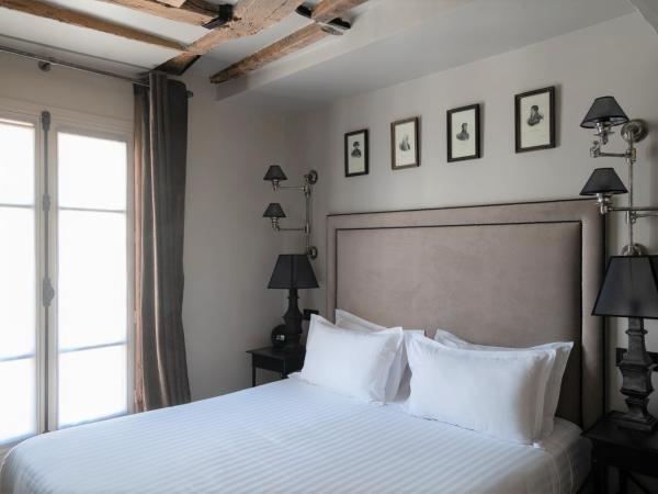 Hotel Saint-Louis en L'Isle - Notre-Dame : photo 1 de la chambre chambre double ou lits jumeaux supérieure avec balcon
