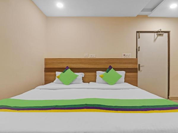 Treebo Pride Inn Botanica : photo 3 de la chambre chambre double standard