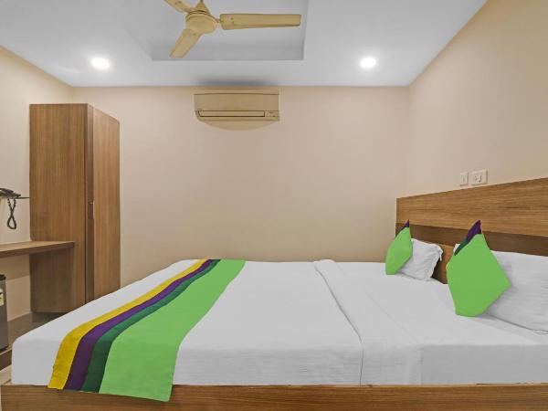 Treebo Pride Inn Botanica : photo 5 de la chambre chambre double standard