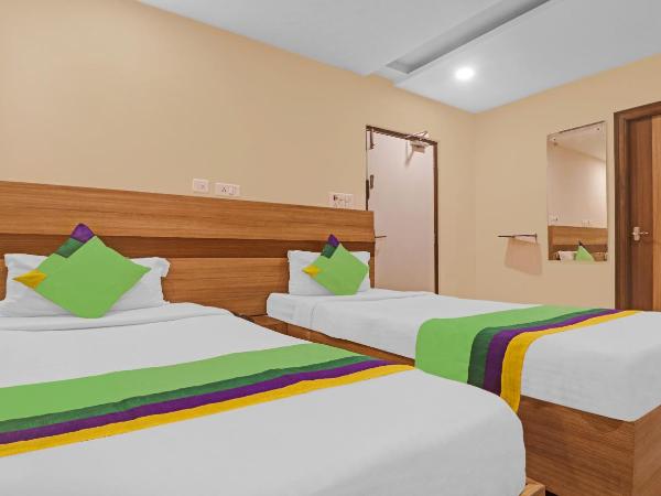 Treebo Pride Inn Botanica : photo 6 de la chambre chambre double standard