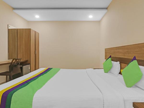 Treebo Pride Inn Botanica : photo 2 de la chambre chambre double deluxe