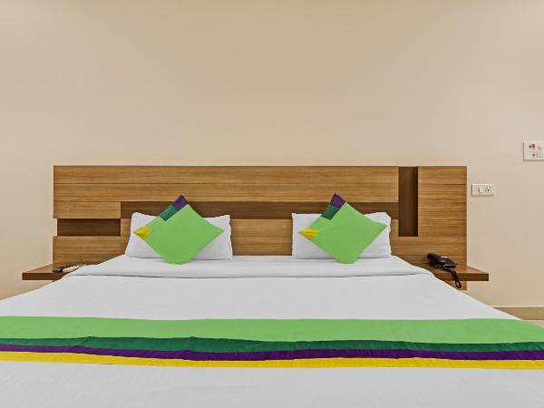 Treebo Pride Inn Botanica : photo 3 de la chambre chambre double deluxe