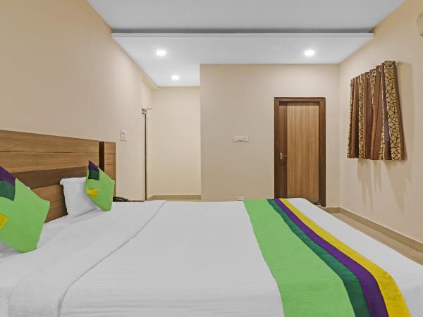 Treebo Pride Inn Botanica : photo 4 de la chambre chambre double deluxe