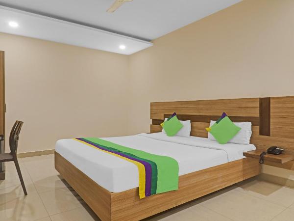 Treebo Pride Inn Botanica : photo 1 de la chambre chambre double deluxe