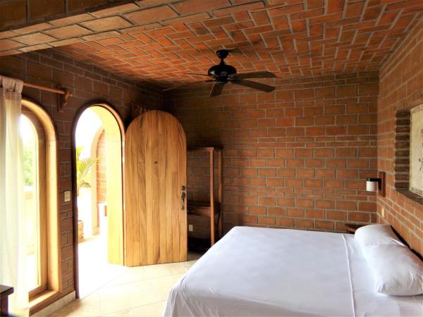 Hotel Casa de Lirio Diamante : photo 1 de la chambre chambre lit king-size standard