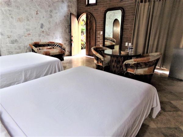 Hotel Casa de Lirio Diamante : photo 4 de la chambre chambre avec 2 grands lits queen-size 