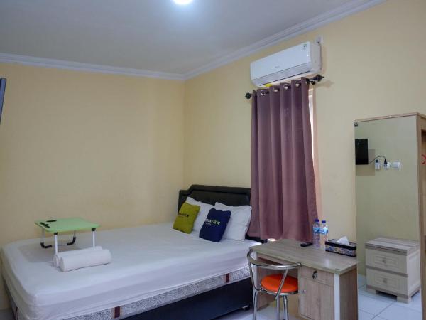 Urbanview Hotel Jogja City Mall : photo 4 de la chambre chambre double deluxe