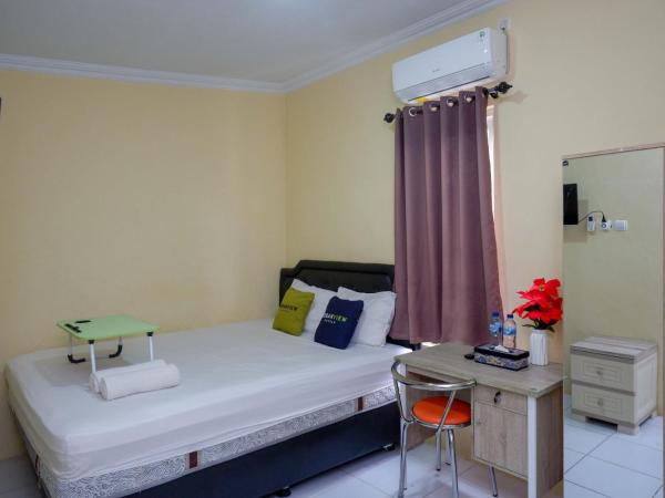 Urbanview Hotel Jogja City Mall : photo 5 de la chambre chambre double deluxe