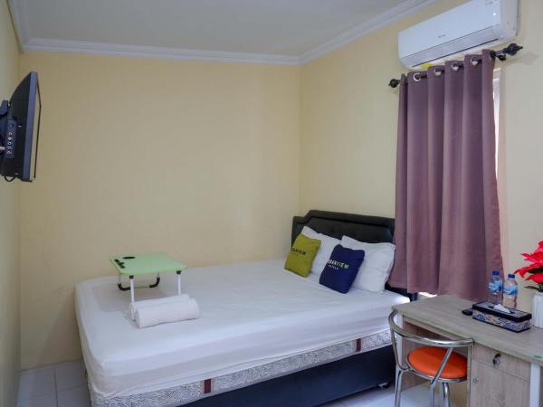 Urbanview Hotel Jogja City Mall : photo 8 de la chambre chambre double deluxe