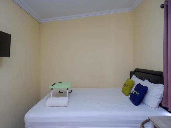 Urbanview Hotel Jogja City Mall : photo 10 de la chambre chambre double Économique