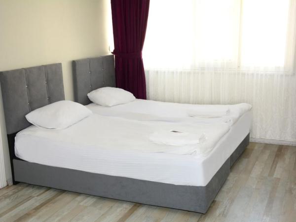 palmiye suıt otel : photo 1 de la chambre appartement