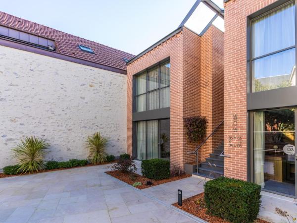 Les Trésorières : photo 1 de la chambre chambre prestige accessible aux personnes à mobilité réduite (annexe « le cube »)