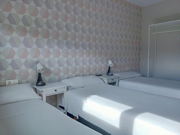 Pensión Boutique AdMera Cerca hospital Clínico : photo 7 de la chambre chambre triple