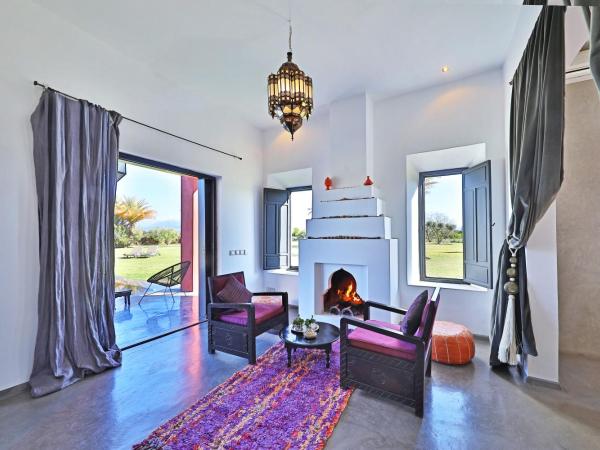 DAR NOUJOUM : photo 2 de la chambre chambre lit king-size - vue sur piscine 