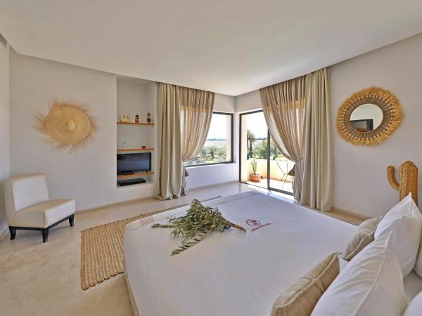 DAR NOUJOUM : photo 2 de la chambre chambre lit king-size - vue sur montagne