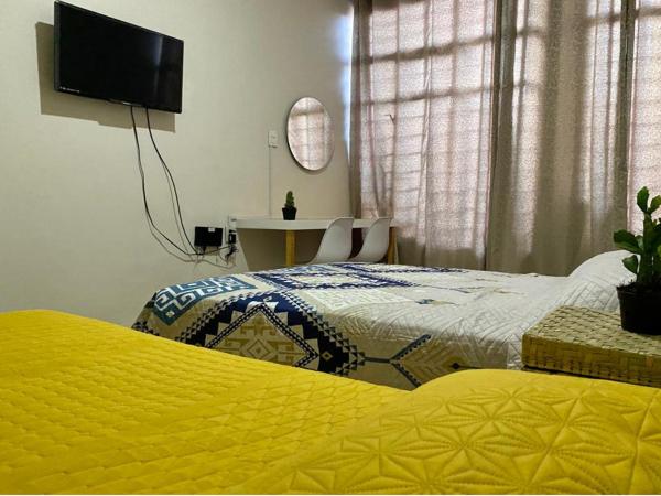 CASA CEMPOAL : photo 3 de la chambre chambre triple avec salle de bains commune