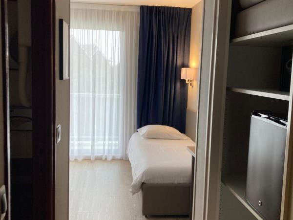 Hotel Europa : photo 4 de la chambre chambre triple familiale - vue sur jardin (2 adultes + 1 enfant) 