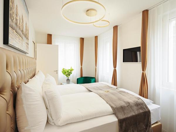 EH Apartments Merkur : photo 7 de la chambre suite deluxe avec lit king-size