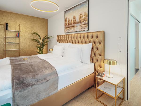 EH Apartments Merkur : photo 3 de la chambre suite deluxe avec lit king-size