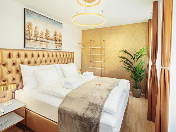 EH Apartments Merkur : photo 1 de la chambre suite supérieure lit king-size