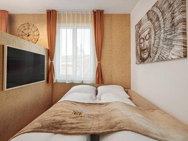 EH Apartments Merkur : photo 9 de la chambre suite deluxe avec lit king-size