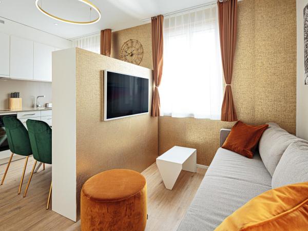 EH Apartments Merkur : photo 2 de la chambre suite deluxe avec lit king-size