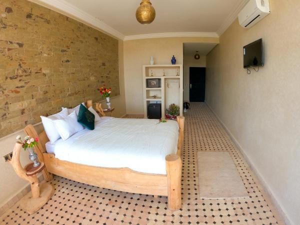 kasbah yu palace : photo 1 de la chambre chambre double ou lits jumeaux - vue sur piscine