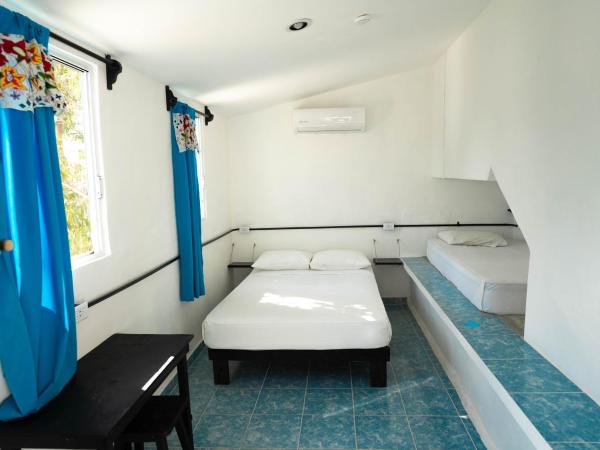 Hostel Oryx Tulum : photo 1 de la chambre chambre triple basique avec salle de bains commune