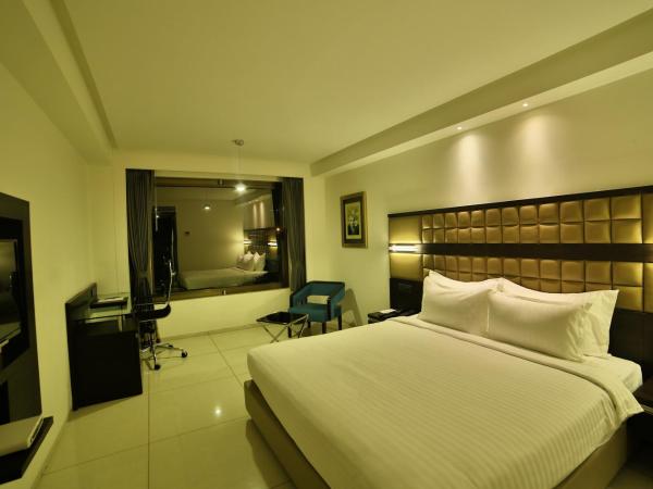 HOTEL G EXPRESS Formerly Known as TGB Express : photo 6 de la chambre deluxe room (locals and unmarried couples are not allowed)