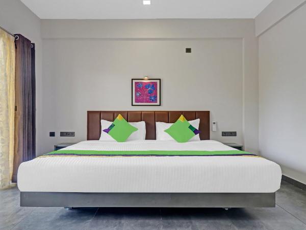 Treebo Grand Vistara Airport Suites : photo 5 de la chambre chambre double supérieure