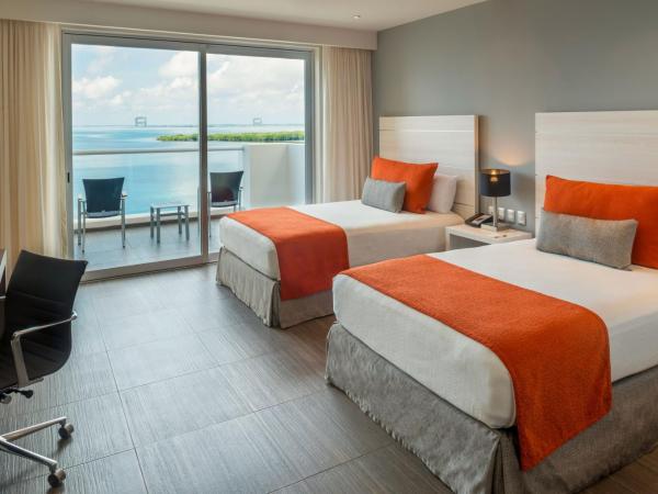 Real Inn Cancún : photo 3 de la chambre hébergement deluxe avec 2 lits - vue sur lagon