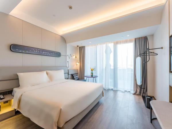 Atour Light Music Hotel Suzhou Panmen Ancient Canal : photo 2 de la chambre chambre double de luxe - vue sur jardin 
