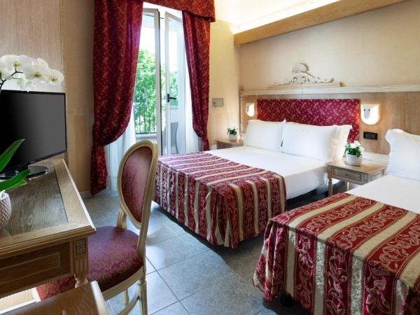 Hotel Gallia Palace : photo 1 de la chambre chambre triple classique